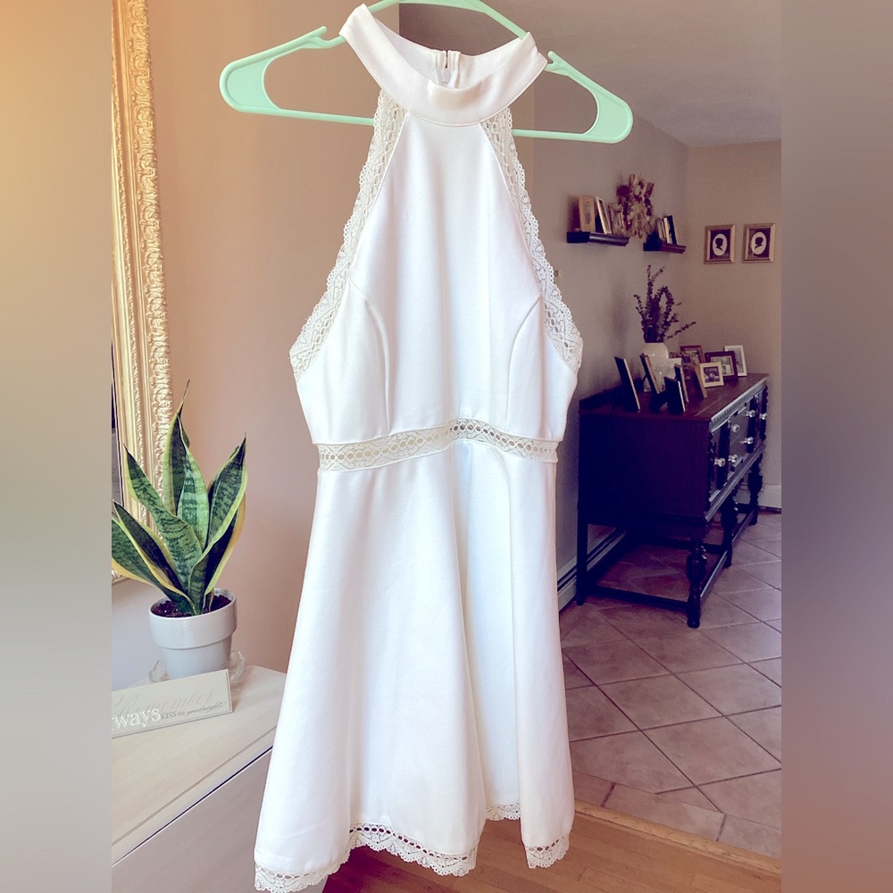 Trendy white halter dress with lace trim. Skater style mini dress. Lulus size M
